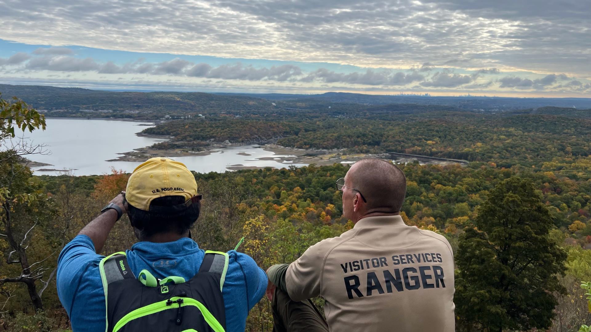 Park Rangers overlooking skyline